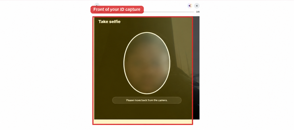 A computer screen displays a blurred face inside an oval with the message "Please move back from the camera" and the heading "Take selfie." There is also a label above that reads "Front of your ID capture." This step is part of Deriv account verification, guiding users through capturing their selfie and proof of identity to verify their Deriv account securely. A computer screen displays a blurred face inside an oval with the message "Please move back from the camera" and the heading "Take selfie." There is also a label above that reads "Front of your ID capture." This step is part of Deriv account verification, guiding users through capturing their selfie and proof of identity to verify their Deriv account securely.