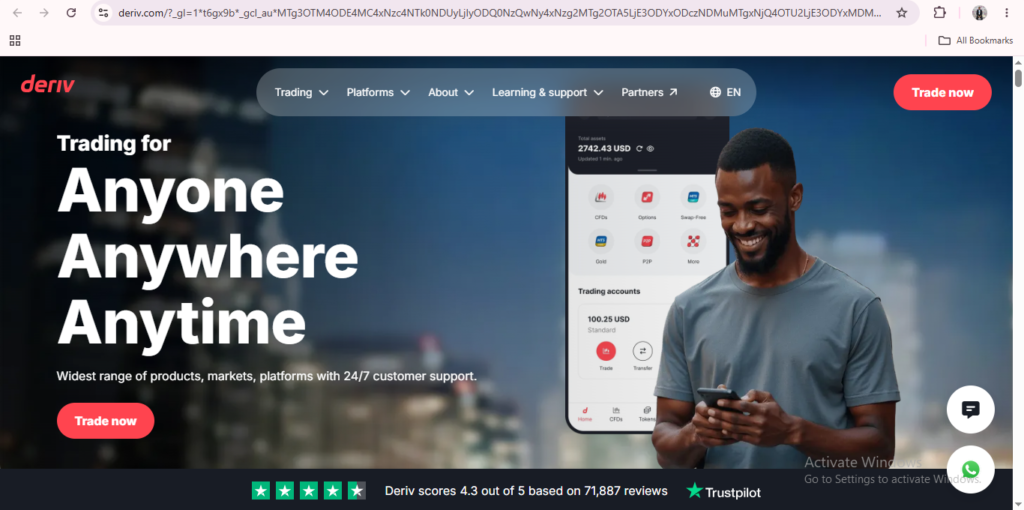 Smiling man using his phone in front of a cityscape, with a trading app interface showcasing Deriv dashboard features and the text “Trading for Anyone Anywhere Anytime” on the screen.
