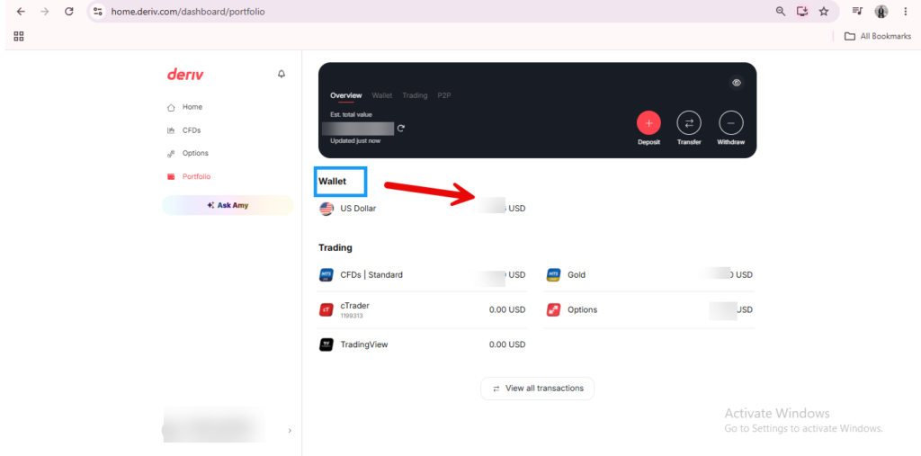 Screenshot of a user’s dashboard on Deriv, showing the Deriv Wallet balance in US dollars with a blue arrow pointing to “Wallet.” You can also check Deriv balance details for CFDs, cTrader, and TradingView, which are visible on the screen.