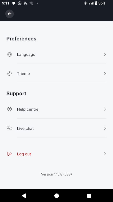 A smartphone screen displays the Deriv mobile app settings menu, featuring options such as Language, Theme, Help centre, Live chat, and Deriv logout for enhanced account security. The battery is at 35%, and the time reads 9:11. App version 1.15.8 (588) appears at the bottom of the screen.